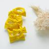 handmade simple bows school colours maroon 1 pairs Bright yellow bow headbands on white background