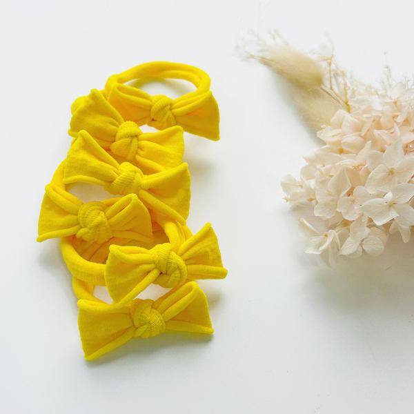 handmade simple bows school colours maroon 1 pairs Bright yellow bow headbands on white background