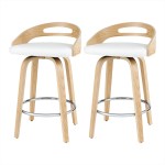 Two modern wooden bar stools with white seats