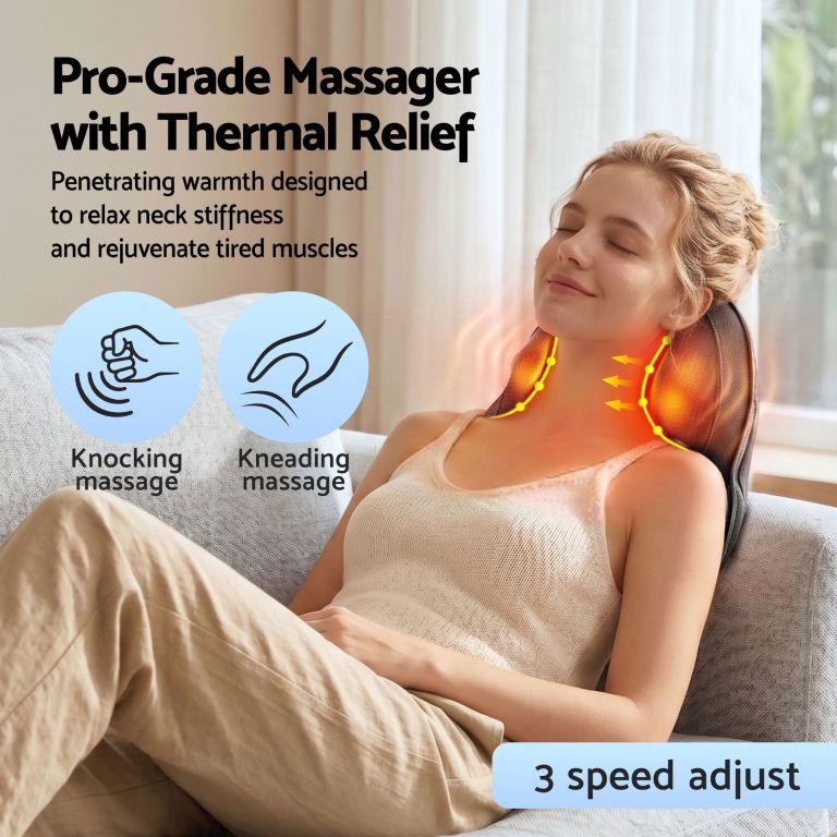 Woman using heated neck massager on sofa