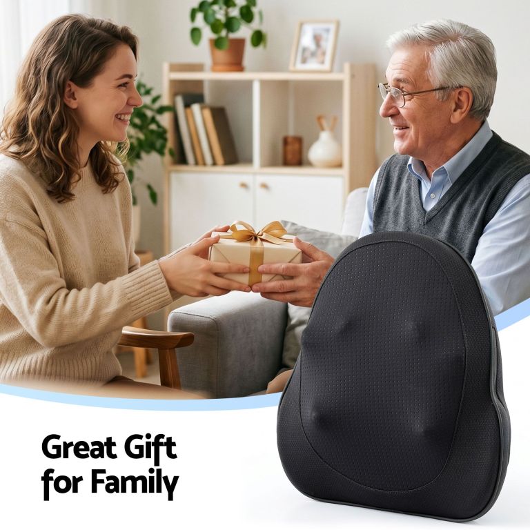 Woman giving older man wrapped gift at home