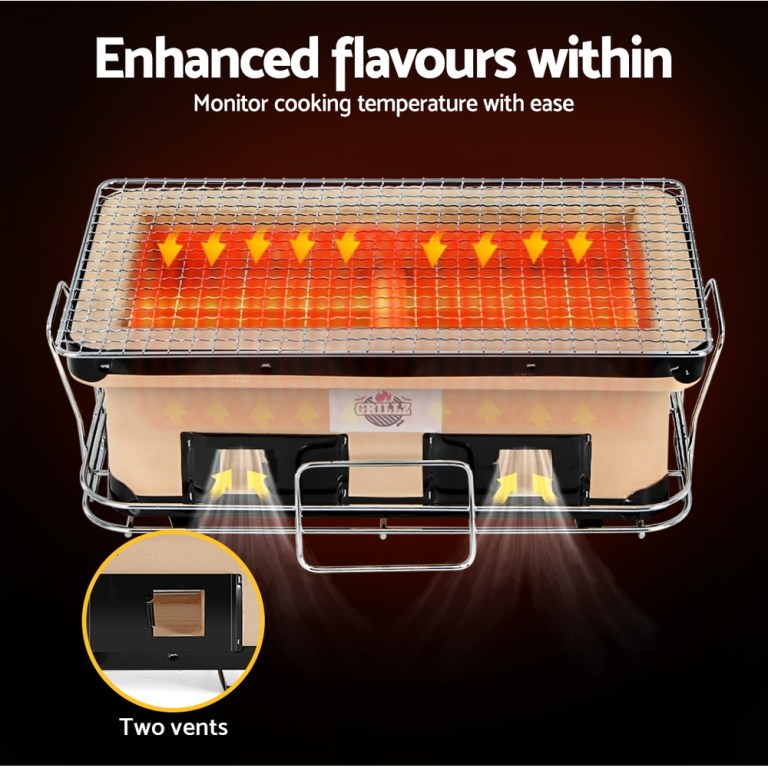Rectangular charcoal grill with glowing coals and vents