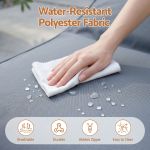 Hand wiping water from polyester fabric sofa