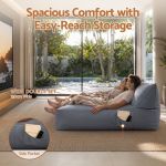 Couple relaxing on wide sofa with side pocket
