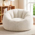Plush cream round lounge chair in bright living room
