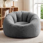 Plush grey round accent chair in bright living room