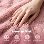 Hand touching soft pink plush fabric