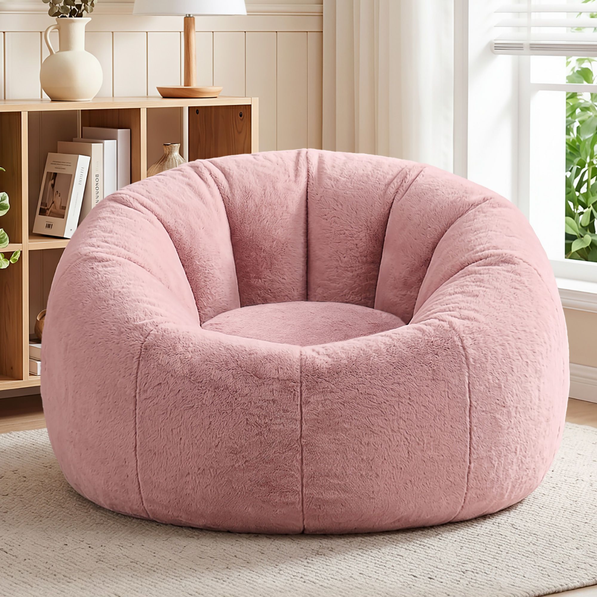 Plush pink round accent chair in bright living room