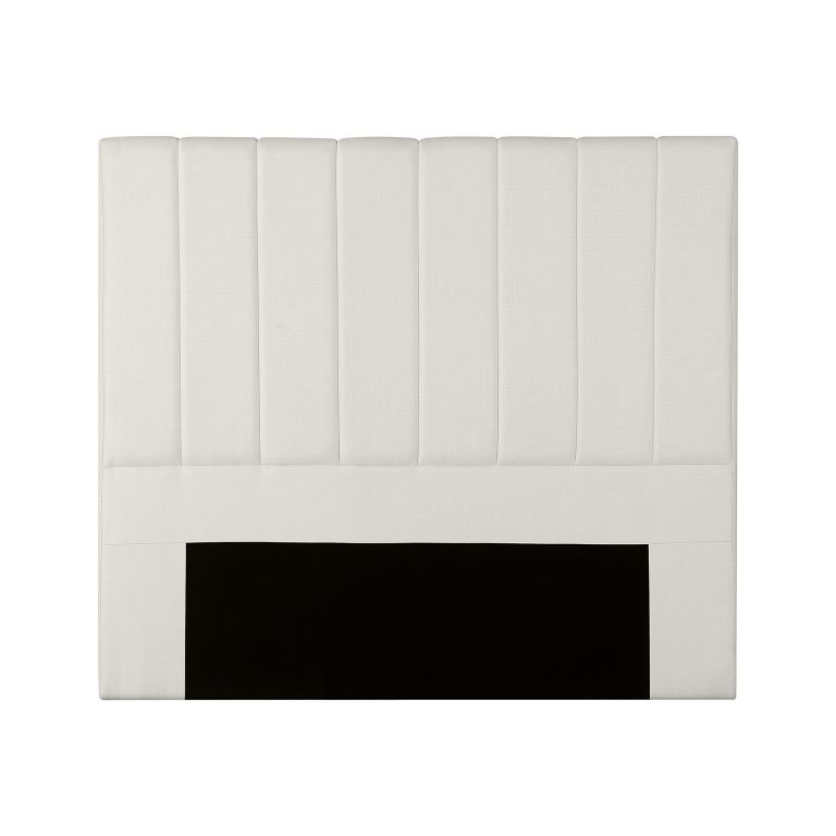 Beige upholstered headboard with vertical panel design