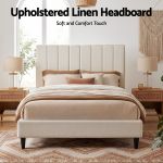 Upholstered linen headboard in modern neutral bedroom