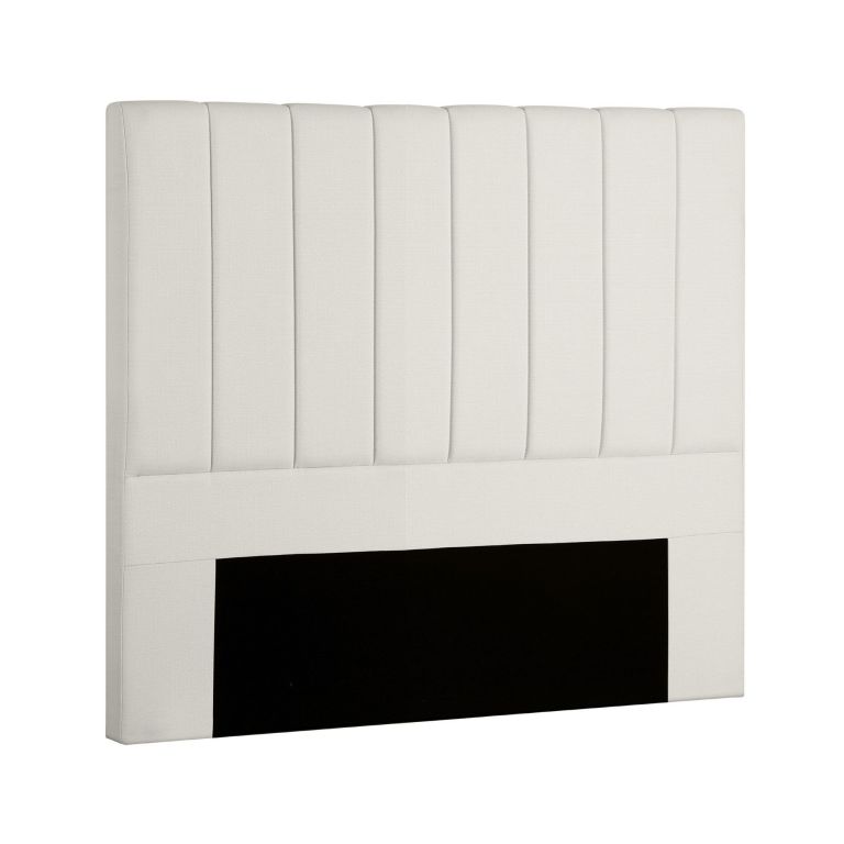 Cream upholstered bedhead with vertical panels