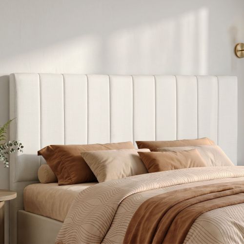 Modern upholstered headboard with neutral bedding