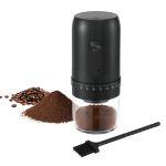 Black electric coffee grinder with beans and grounds