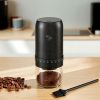 Black electric coffee grinder with ground coffee