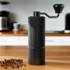 devanti manual coffee grinder with 24 adjustable settings | hand coffee bean burr mill for espresso french press | portable stainless steel quiet grinder with storage bag for travel camping, black Black manual coffee grinder with beans on bench