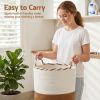 artiss woven laundry basket with handles foldable white & brown Woman carrying rope-handled laundry basket indoors