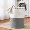Woven laundry basket beside front-loading washing machine