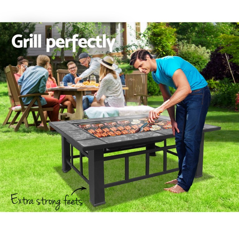grillz fire pit bbq grill ice bucket 3 in 1 table Man grilling meat on outdoor barbecue table
