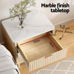 Marble top bedside table with open drawer