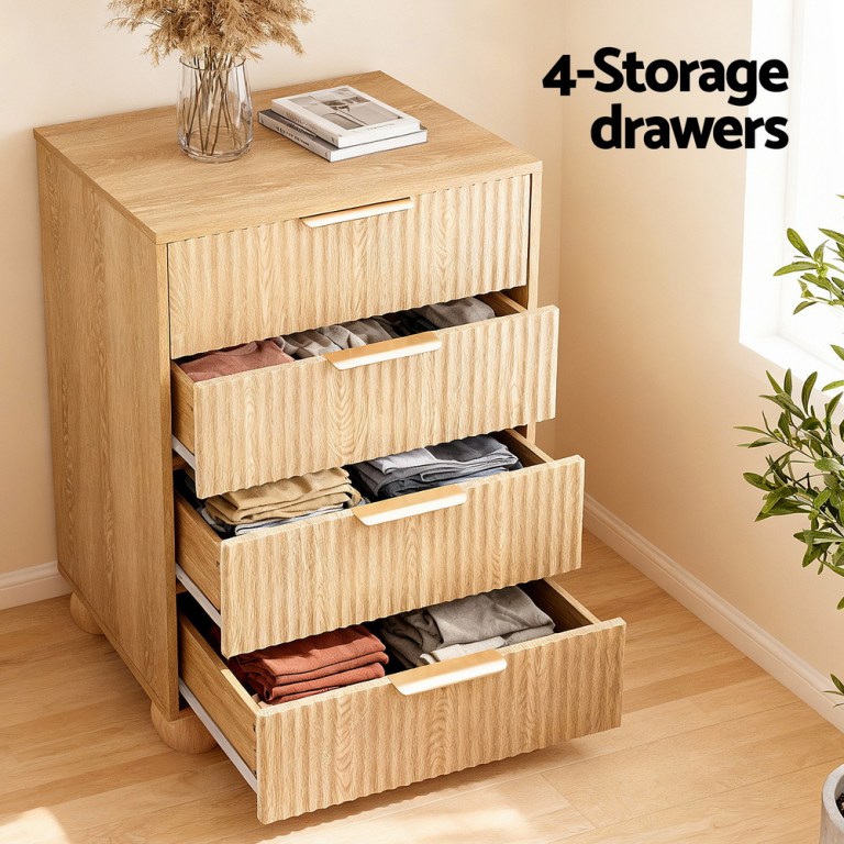 Wooden four-drawer storage chest with folded clothes