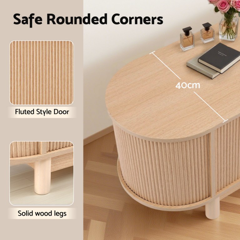 Rounded wooden bedside table with fluted door