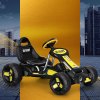 rigo kids pedal go kart ride on toys racing car plastic tyre black Black and yellow go-kart with city backdrop