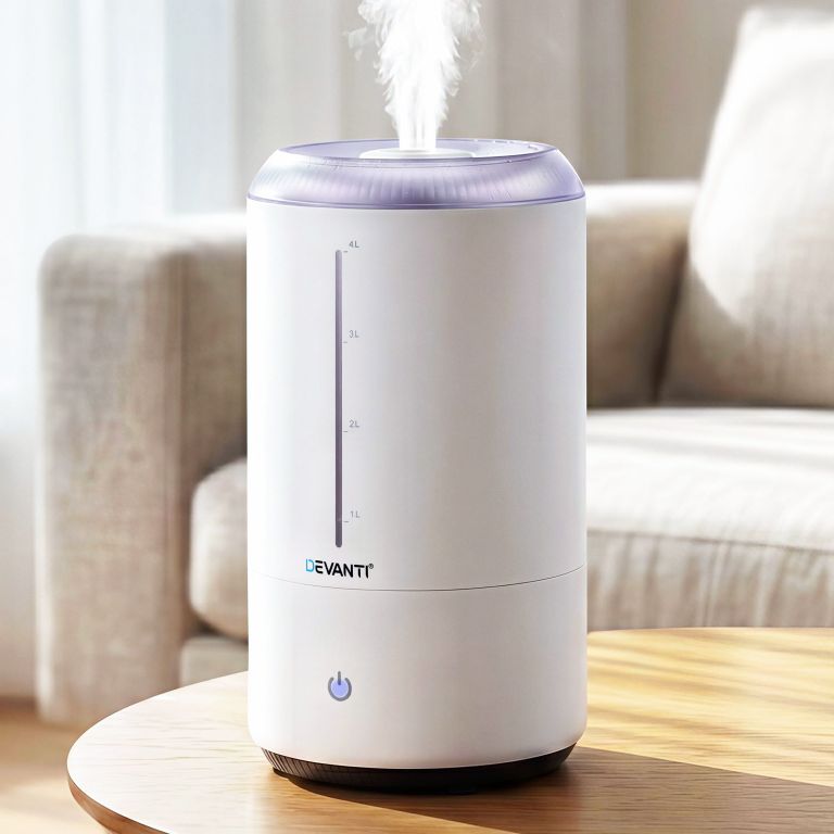 hm 4l touch wh 00.jpg Devanti humidifier emitting mist on wooden table