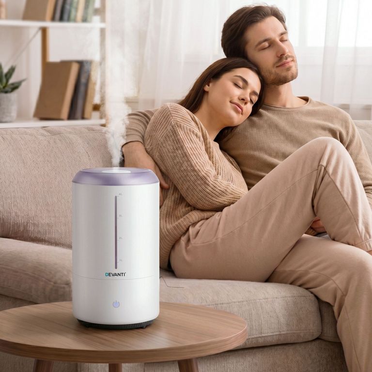devanti ultrasonic humidifier aroma diffuser top fill quiet bedroom 4l white Couple relaxing beside humidifier in cosy living room