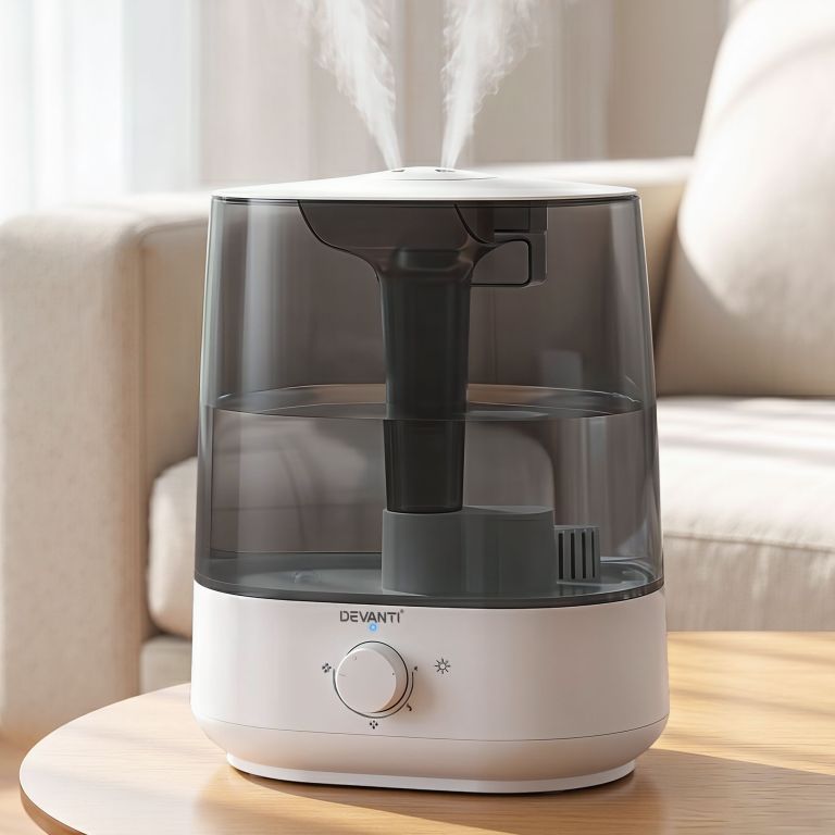 Devanti humidifier releasing mist on table