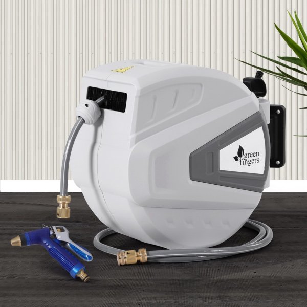 Wall-mounted retractable garden hose reel with spray nozzle