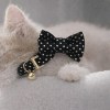 image 1 Cat wearing black polka dot bow tie collar