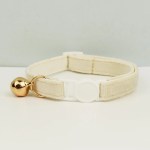 image 1 Cream cat collar with gold bell and buckle