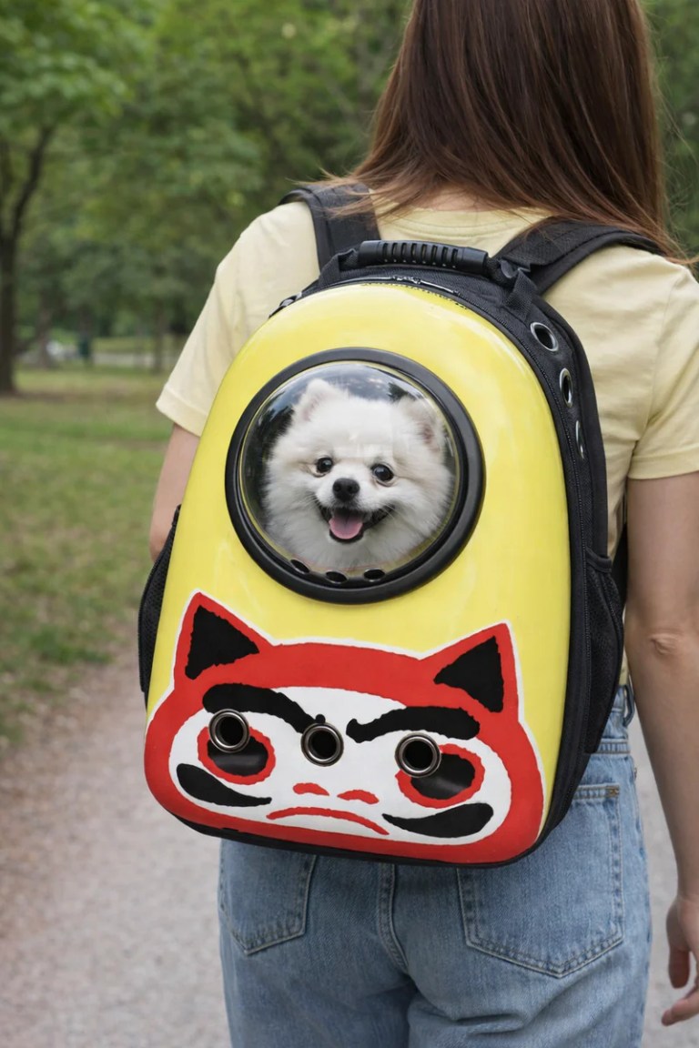 Small white dog in yellow backpack carrier