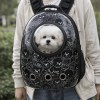 image 1 Small white dog in bubble backpack carrier