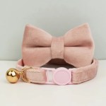 Pink plush pet collar with bow and bell