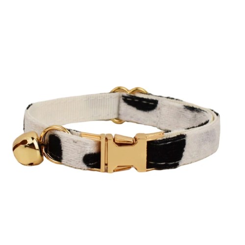 Black and white cat collar with gold bell