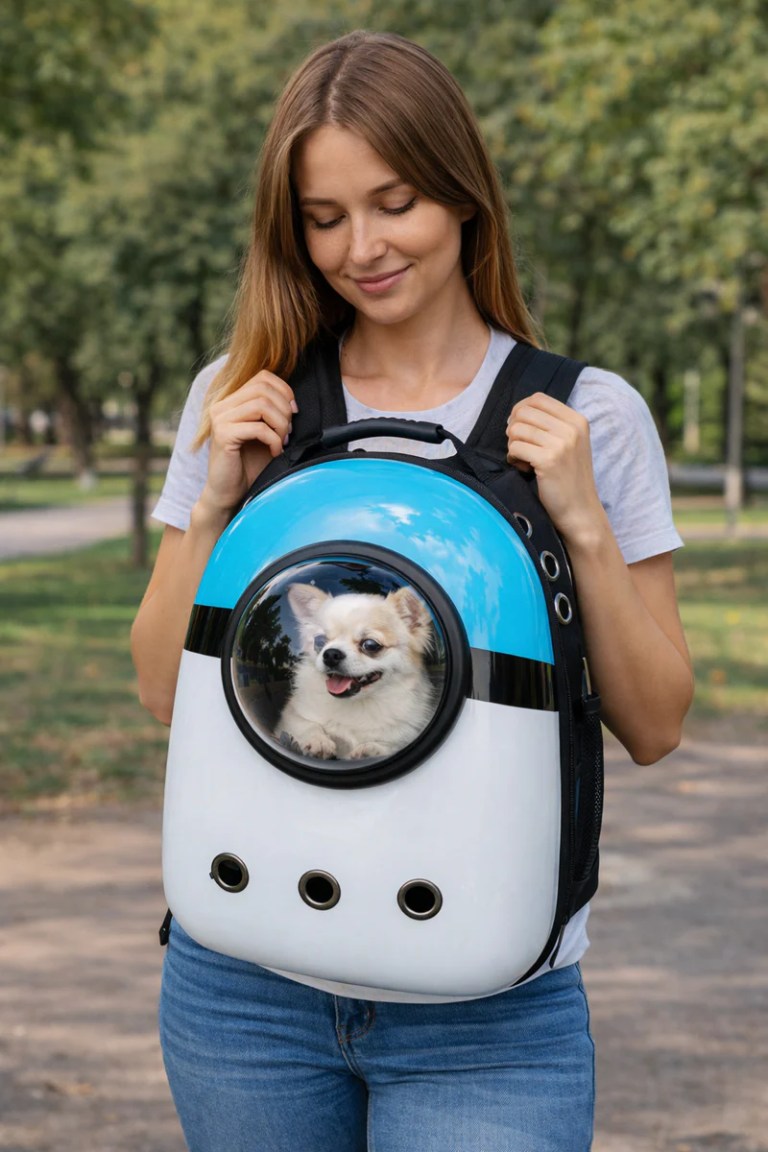 image 2 Woman carrying dog in bubble backpack carrier