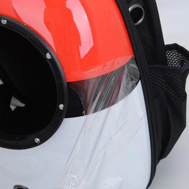 Close-up of red pet carrier backpack
