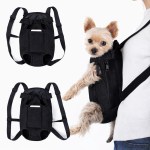 Small dog in black front carrier backpack