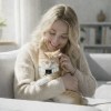 image 3 Woman cuddling ginger cat on sofa