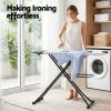 Woman ironing shirt in bright laundry room