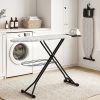 Modern laundry with ironing board and washing machine