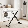 Modern laundry with ironing board and washing machine