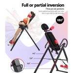 Adjustable inversion table with woman demonstrating tilt positions