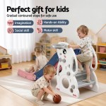Toddlers playing on indoor slide in playroom