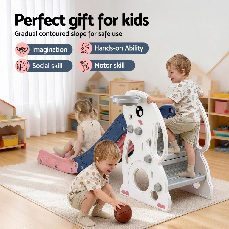 Toddlers playing on indoor slide in playroom
