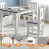 Children’s white table and chairs set with crayons