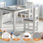 Children’s white table and chairs set with crayons