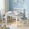 Children’s table with pencils in blue playroom