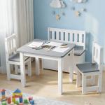 Children’s table with pencils in blue playroom